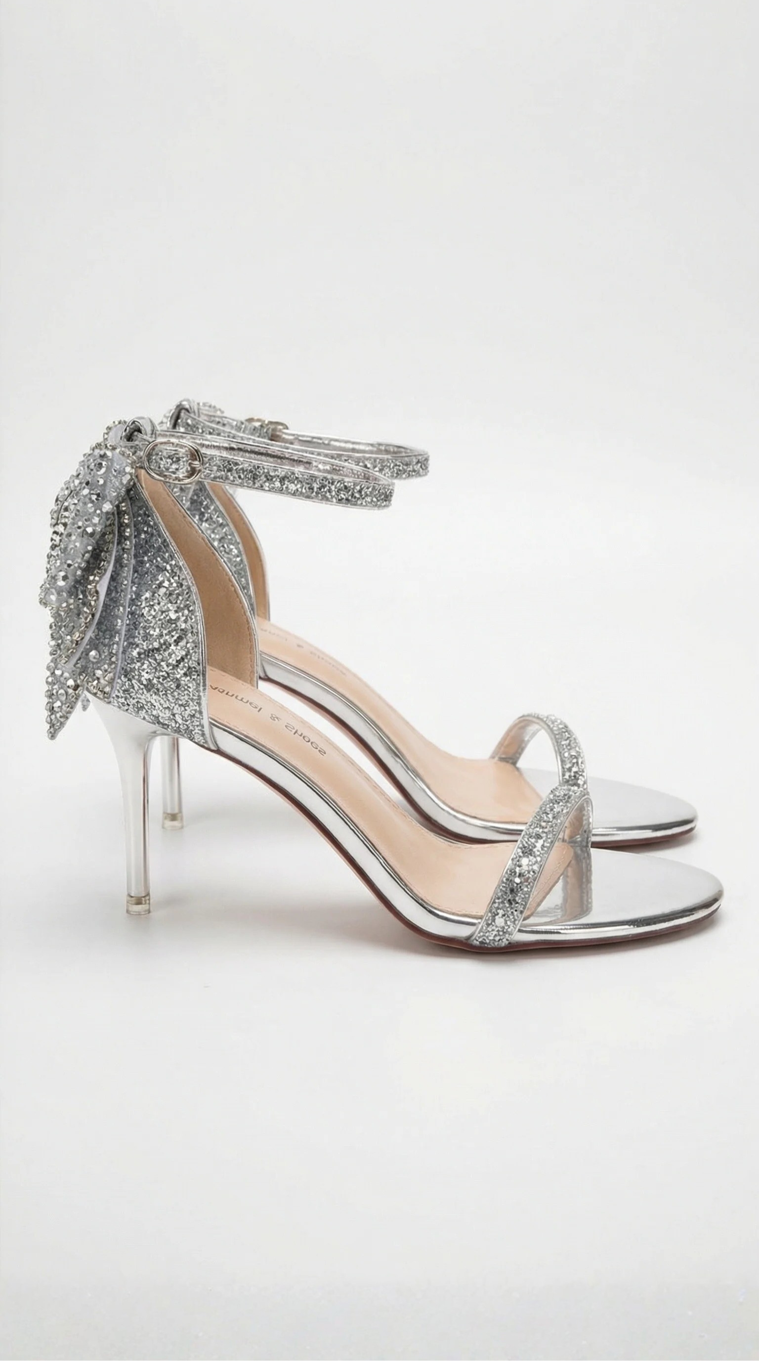 Heeled sandals with bow and embellishments